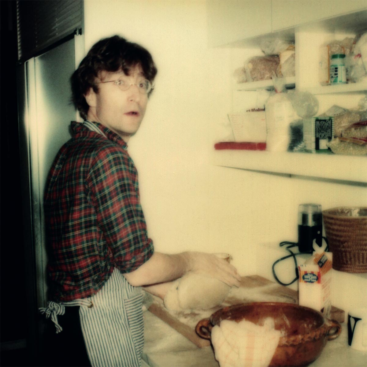 Polaroid of domestic life with the Lennons at The Dakota with John baking bread